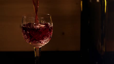 Red-wine-is-poured-into-a-glass