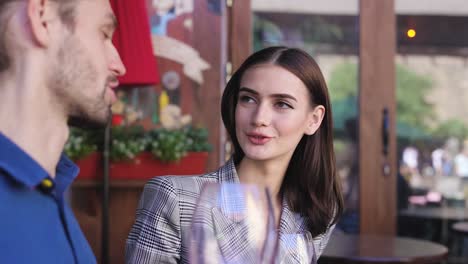 Couple-Drinking-Wine-On-Date-At-Restaurant,-People-With-Drink