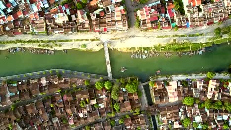 camara-hangs-above-channel-with-bridge-in-Hoian