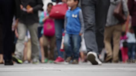 Chinese-people-walking-on-the-street-in-the-commercial-district.