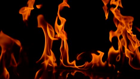 Flames-of-fire-on-black-background-in-slow-motion