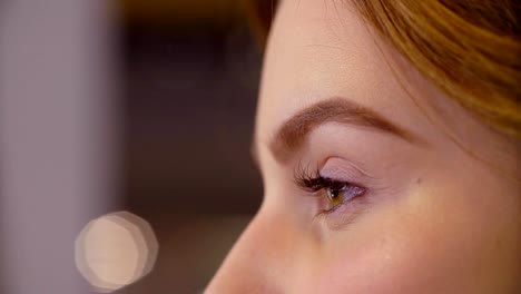 The-makeup-artist-correcting-the-shape-of-eyebrow