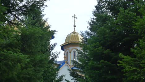 Orthodox-church,-Catholic-church,-dome-of-a-church-against-a-blue-sky,-Against-the-skyGolden-domes