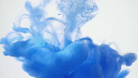 Close-up-blue-ink-being-poured-into-water.