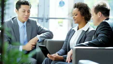 Multi-ethnic-male-female-business-people-in-meeting