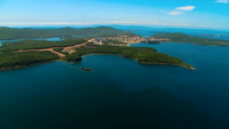 Helicopter-flies-over-the-water-area-of-the-sea-and-over-the-island