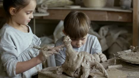 Children-Sculpting-with-Clay-in-Pottery-Workshop