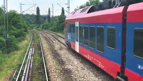 Belgrade,-Serbia,---May-26,-2018:-Modern-train-passenger-composition-passing-through-in-Belgrade,-Serbia.