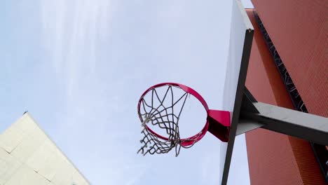 A-red-basketball-ring-on-the-basketball-court-outside