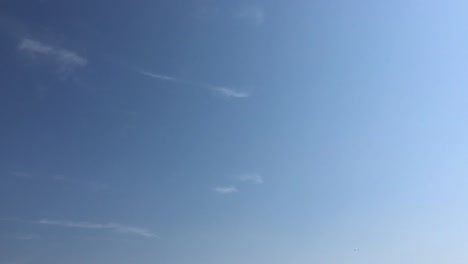 White-clouds-disappear-in-the-hot-sun-on-blue-sky.-Time-lapse-motion-clouds-blue-sky-background.-Blue-sky.-Clouds.-Blue-sky-with-white-clouds-and-sun.