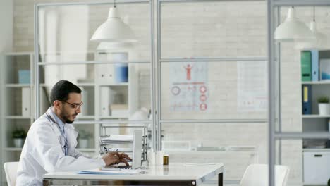 Doctor-Using-Laptop-Computer-for-Work