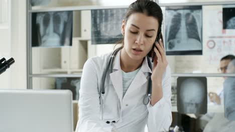 Busy-Female-Doctor-Talking-on-Phone