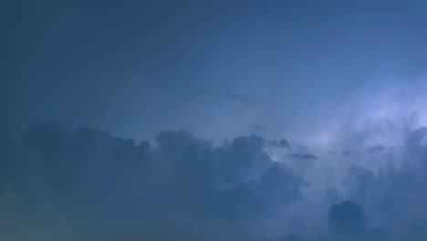 Thunderstorm-clouds-at-night-with-lightning-strike-time-lapse,-4K-timelapse