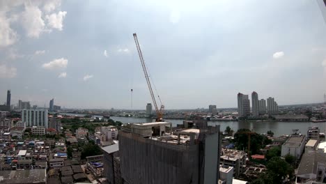 4K-Time-lapse-of-crane-working-in-construction-site