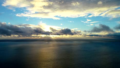 The-flight-above-the-water-on-the-sunrise-background.-time-lapse