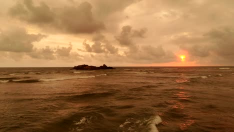 The-flight-above-the-ocean-on-the-sunset-background