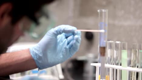 A-university-student-conducts-experiments-during-a-chemistry-lab-class