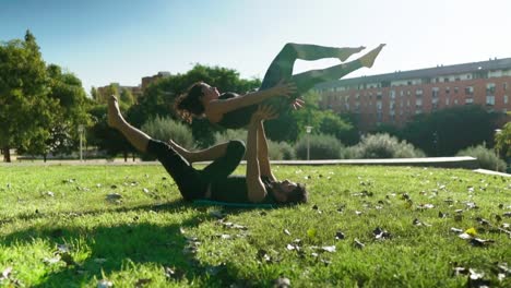 Beautiful-couple-practicing-acro-yoga-in-the-morning