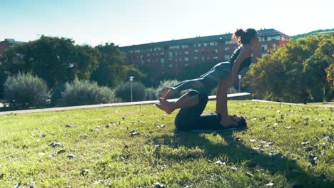 Beautiful-couple-practicing-acro-yoga-in-the-morning