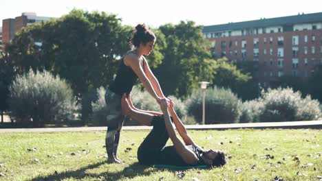 Beautiful-couple-practicing-acro-yoga-in-the-morning