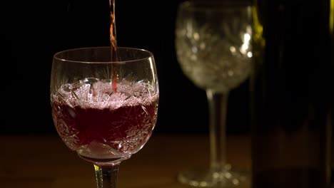 Red-wine-is-poured-into-a-glass