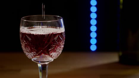 Red-wine-is-poured-into-a-glass