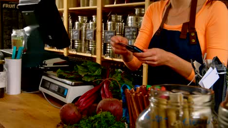 Customer-making-payment-at-counter-in-supermarket-4k