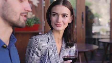 Couple-Drinking-Wine-On-Date-At-Restaurant,-People-With-Drink