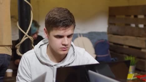 Young-Man-Using-Laptop-Computer