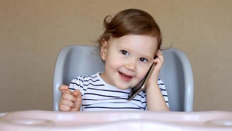 Baby-girl-talking-on-the-phone