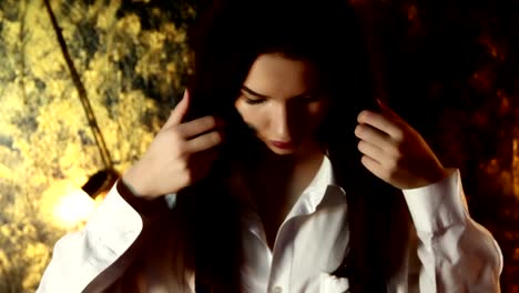 Abstract-image-of-a-girl-in-a-white-shirt-who-keeps-her-hair