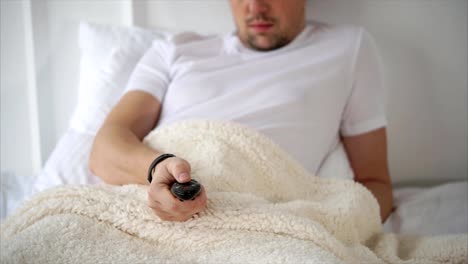 Man-in-bed-with-remote-control