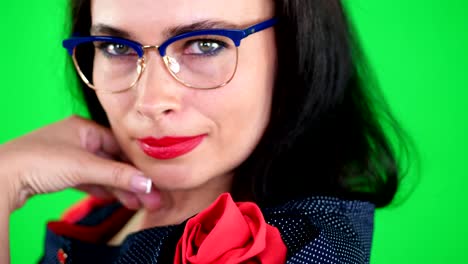 green-background,-chromeakey.-portrait-of-a-sexy-brunette-woman-with-red-lips,-in-stylish-glasses,-spectacles,-eroticly,-playfully-moves,-looking-sexually-at-camera,-posing-in-studio