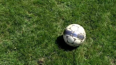 Football-player-hits-the-ball-in-a-slow-motion-close-up