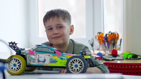 Boy-Posing-with-Toy-Car-Model