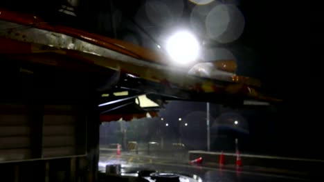 Chinese-lantern-and-awnings-on-shops-blowing-in-typhoon-water-and-rain