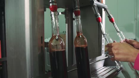 Special-machine-equipment-bottling-red-wine-while-manufacturing