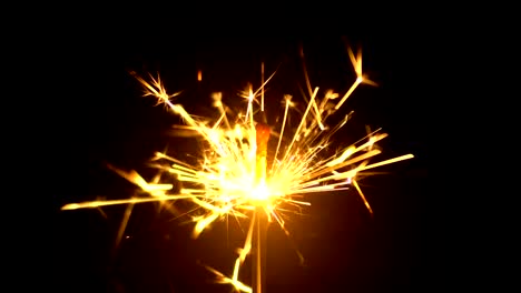 Yellow-Sparklers-is-Sparkling-On-Black-Background-4K