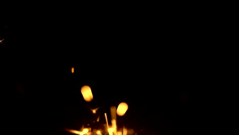 Slow-Motion-Yellow-Sparklers-is-Sparkling-On-Black-Background-Close-Up-3