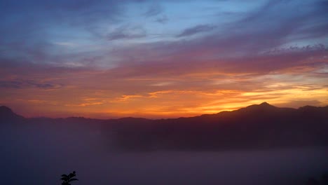 time-lapse-of-sunrise-in-dawn-with-mountain-and-foggy-landscape