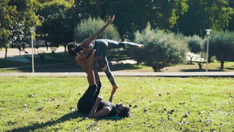 Beautiful-couple-practicing-acro-yoga-in-the-morning