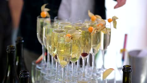 the-groom-and-the-bride-poured-champagne-into-the-wine-glasses