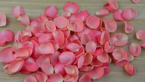 wooden-table-pink-rose-petals-hd-footage