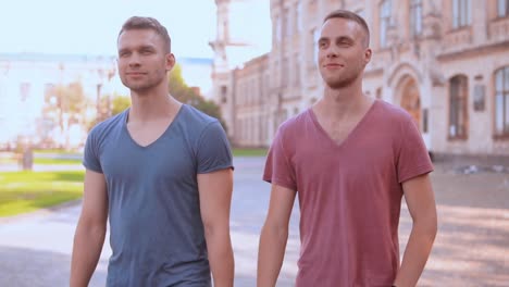 caucasian-young-men-walking-in-campus-area