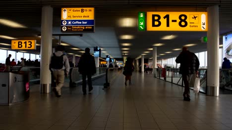 Busy-male-and-female-passengers-hurrying-to-gate-at-airport-terminal,-trip