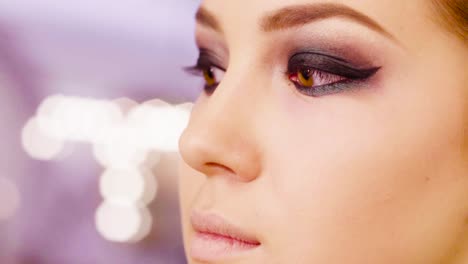 Portrait-of-young-woman-in-makeup-studio