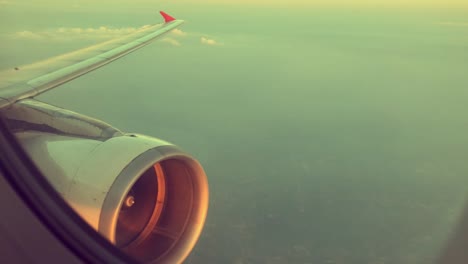 Wing-and-engine-of-airplane-flying-on-sky-and-cloud-on-beautiful-view