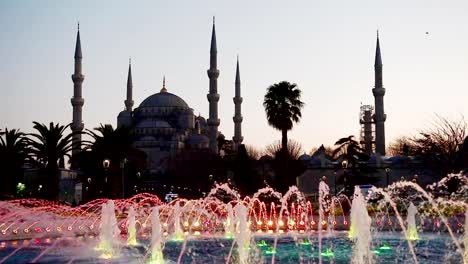 Illuminated-Sultan-Ahmed-Mosque-Blue-Mosque-before-sunrise,-View-of-the-evening-fountain.-Istanbul,-Turkey