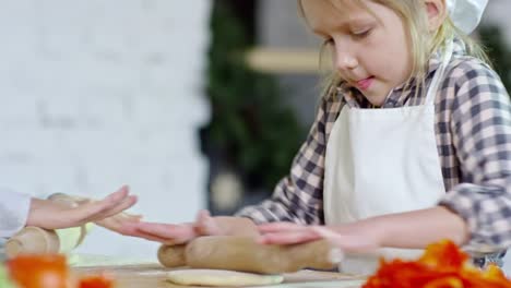 Girl-Trying-to-Roll-Out-Dough