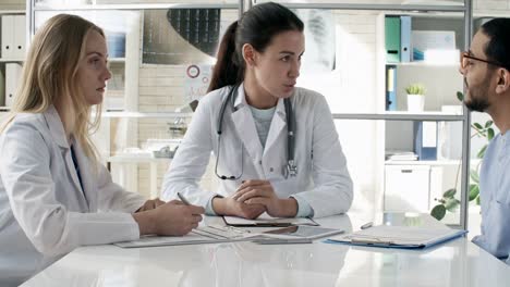 Female-Doctors-Talking-to-Patient-in-Clinic